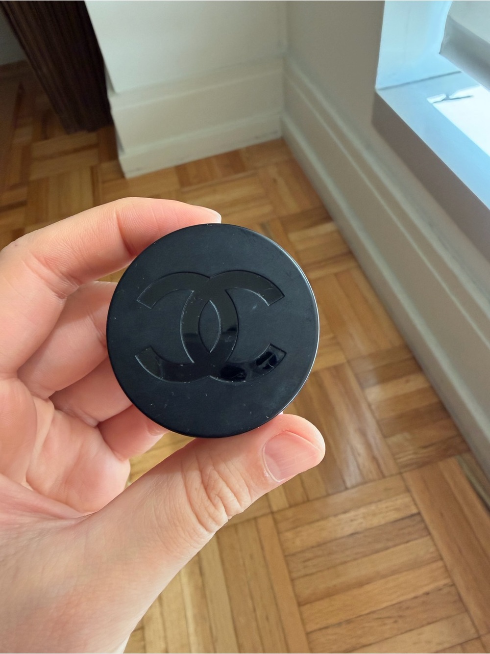 CHANEL Black Round Compact with Raised CC Emblem